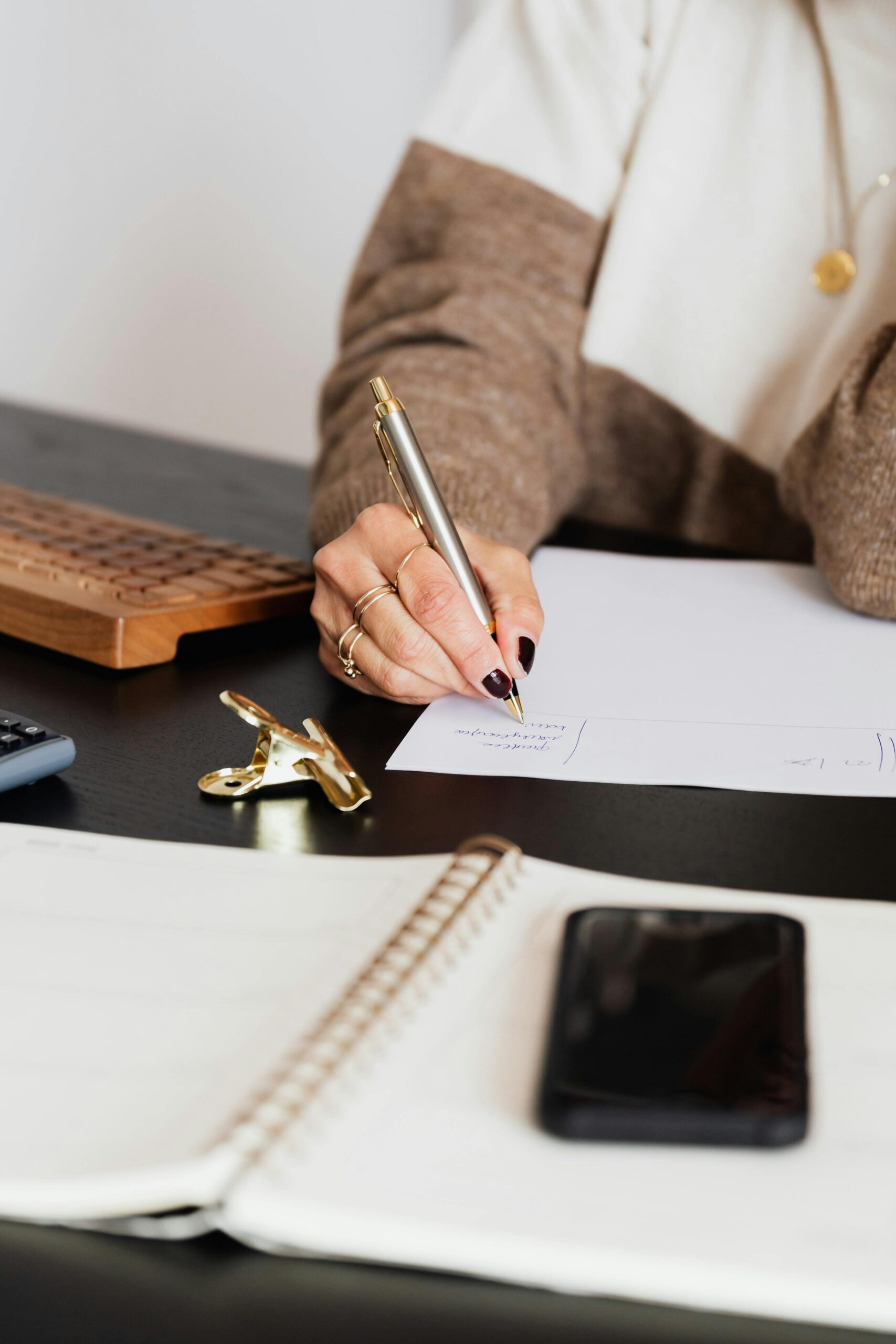 Faceless Aesthetic Business woman in white shirt using smartphone
