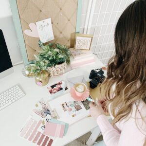 pink and white cards and photos
